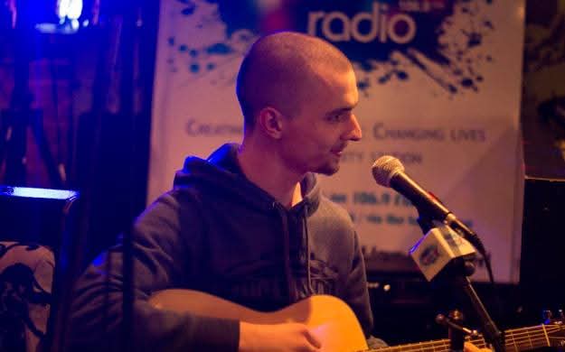 Brendon Ireland performing as an acoustic singer-songwriter